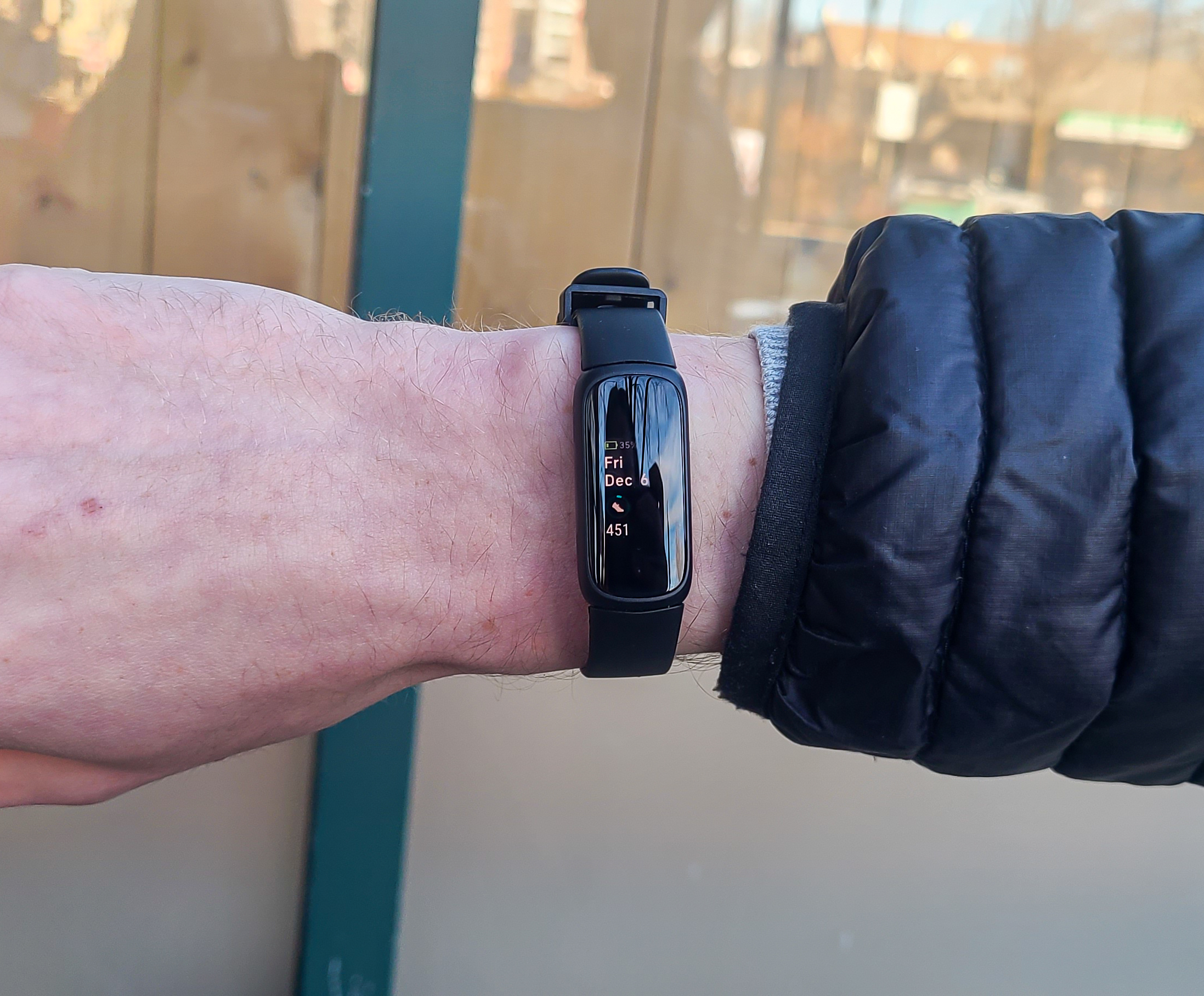 person wearing a black Fitbit Inspire 3